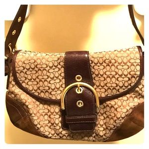 Coach-Brown and tan signature handbag.